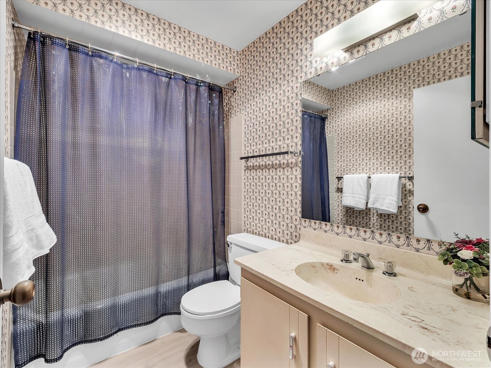 8001 Sand Point Way Northeast, Unit C57 Seattle, WA 98115 - Photo 16 of 23 a bathroom with a sink a toilet and shower