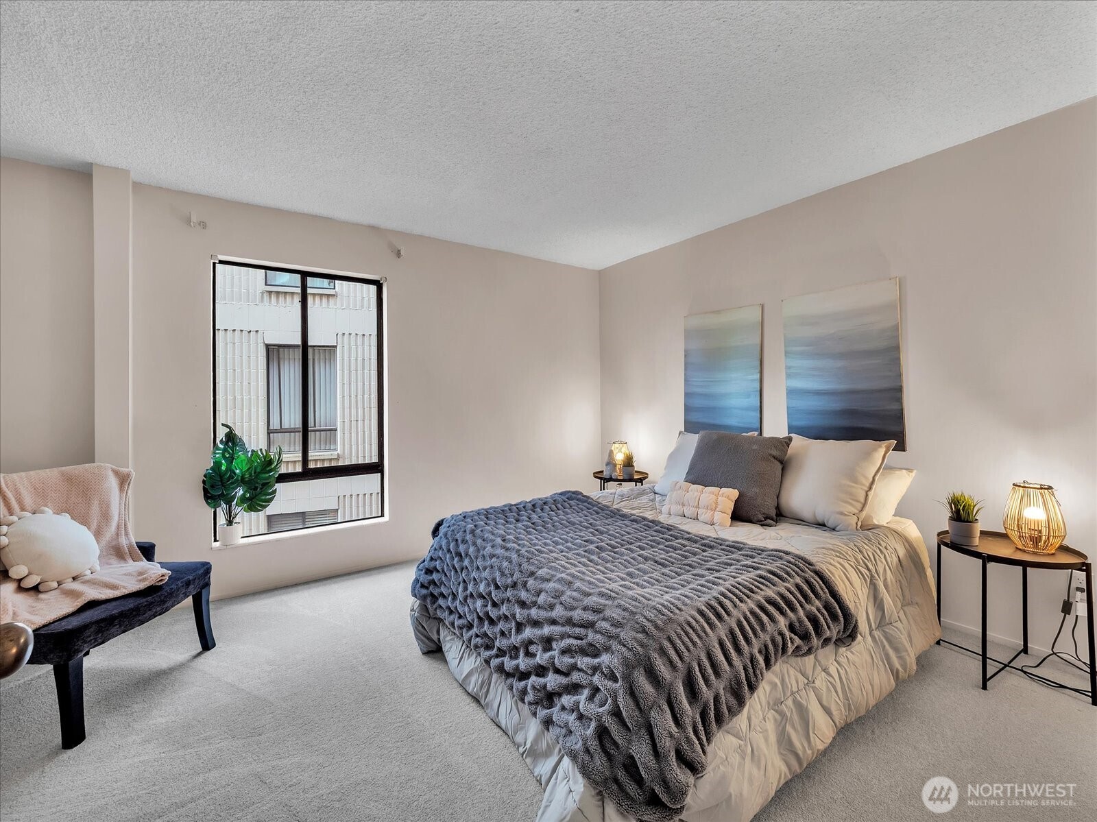 8001 Sand Point Way Northeast, Unit C57 Seattle, WA 98115 - Photo 17 of 23 a bedroom with a bed and a window