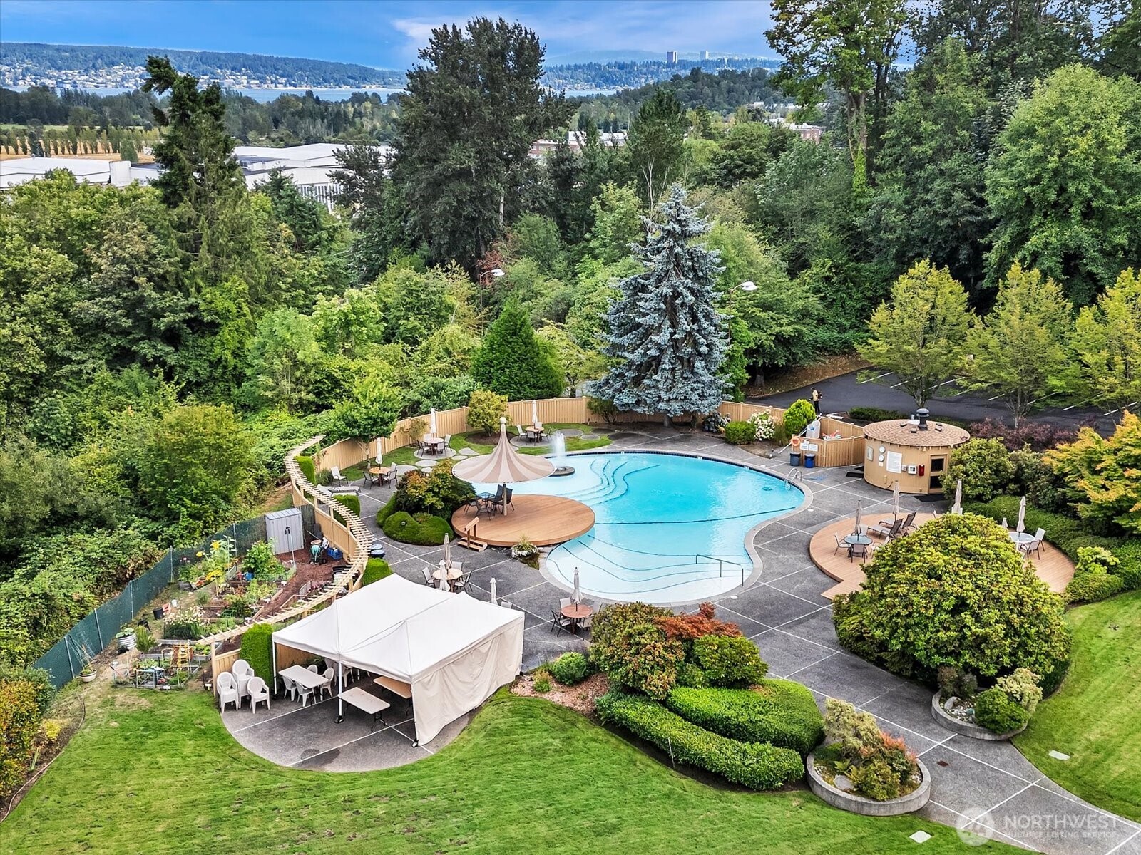 8001 Sand Point Way Northeast, Unit C57 Seattle, WA 98115 - Photo 20 of 23 an aerial view of a house with garden space lake view and mountain view in back