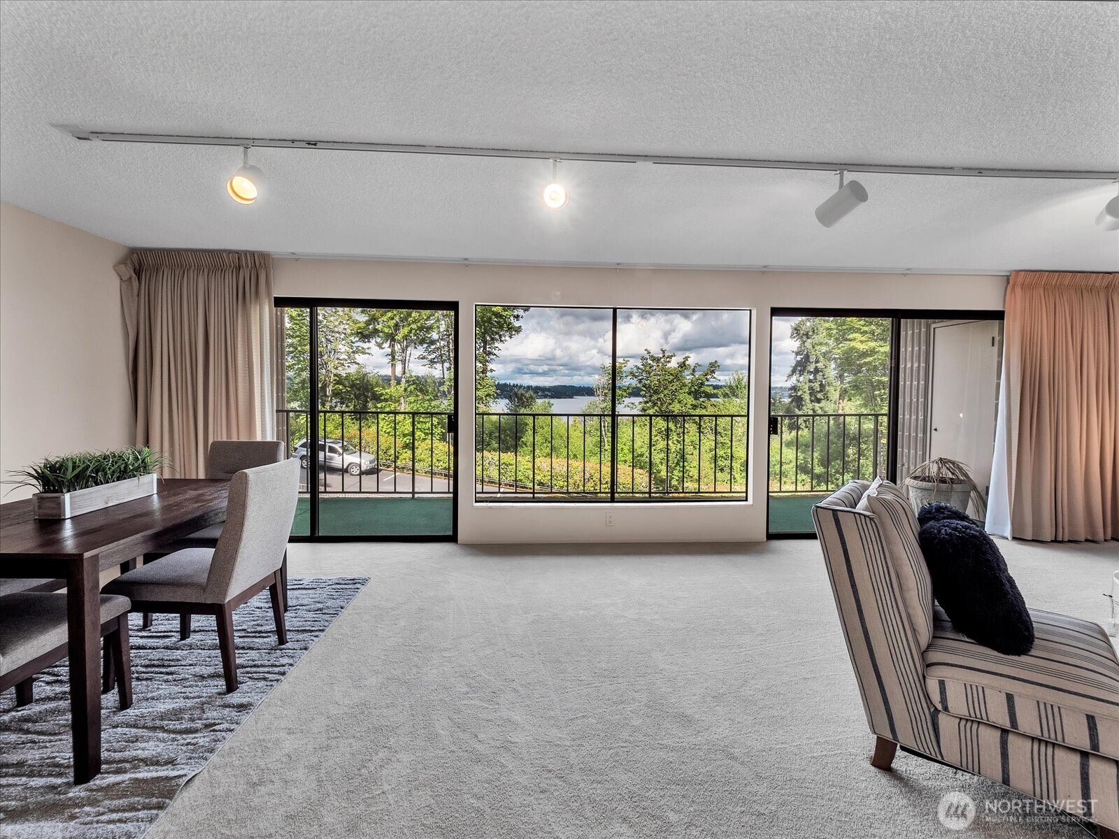 8001 Sand Point Way Northeast, Unit C57 Seattle, WA 98115 - Photo 22 of 23 a living room with furniture and large windows