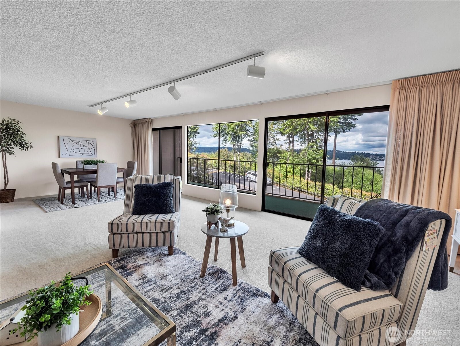 8001 Sand Point Way Northeast, Unit C57 Seattle, WA 98115 - Photo 6 of 23 a living room with furniture and a large window