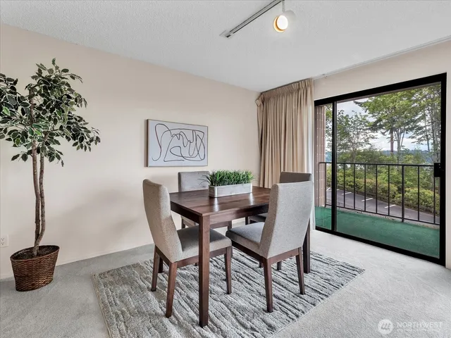 a view of a livingroom with furniture and a potted plant