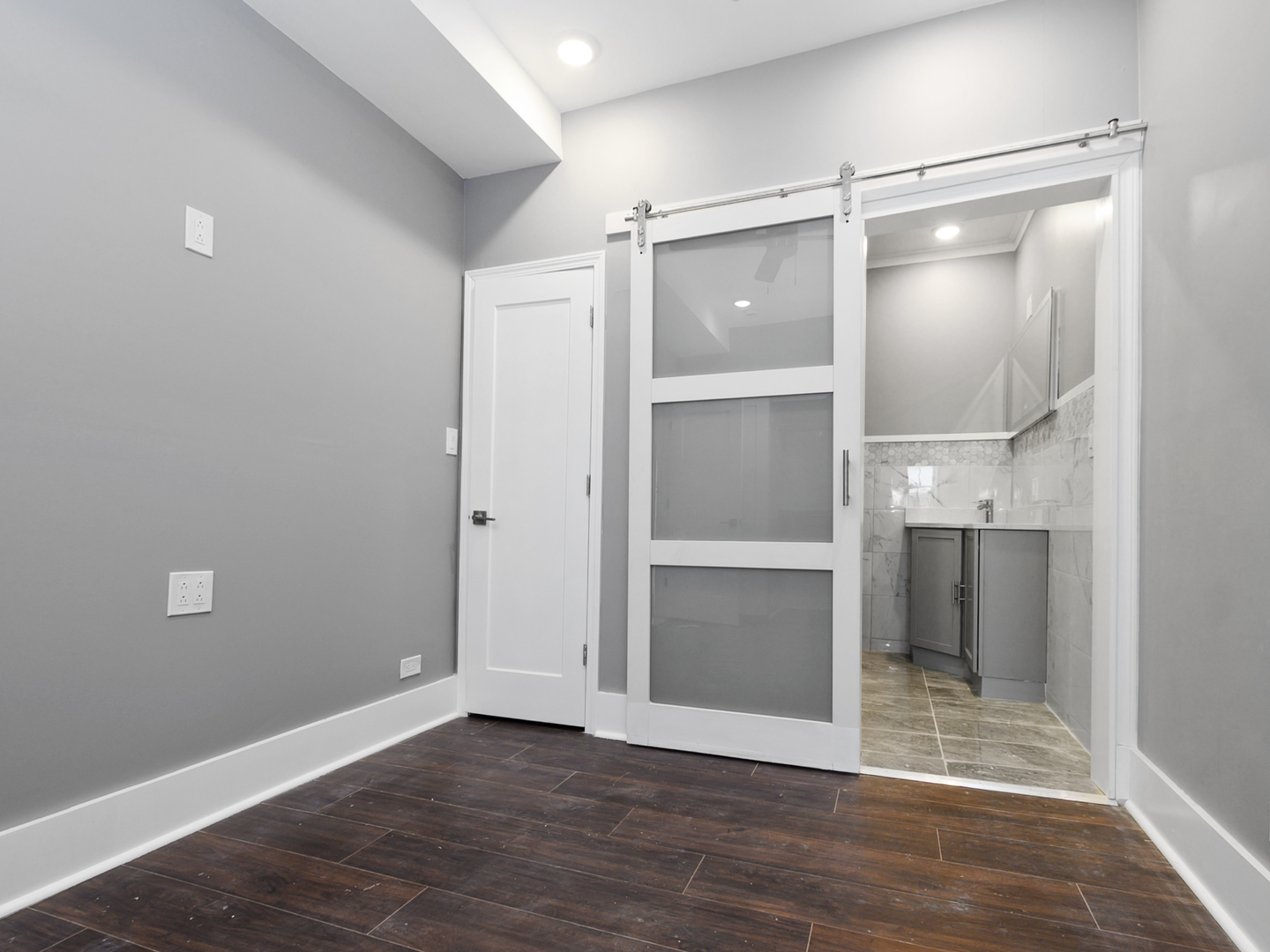 7305 South Sangamon Street Chicago, IL 60621 - Photo 20 of 29 a view of an empty room with wooden floor