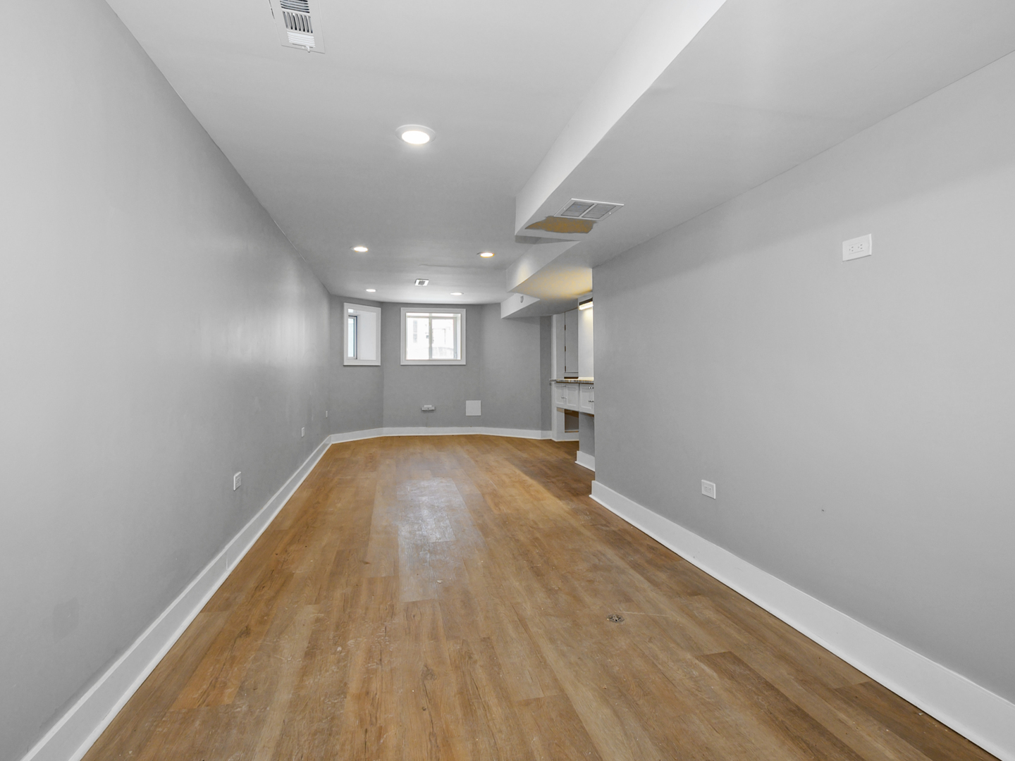7305 South Sangamon Street Chicago, IL 60621 - Photo 24 of 29 a view of empty room with wooden floor