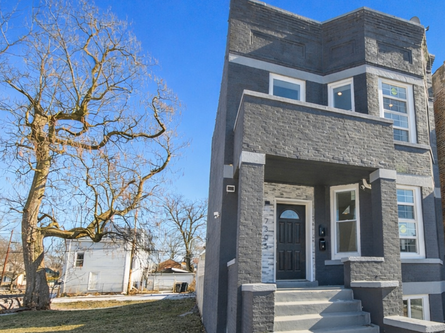 7305 South Sangamon Street Chicago, IL 60621 - Photo 29 of 29 a front view of a house with a yard