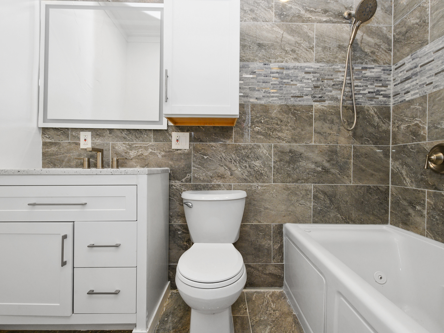 7305 South Sangamon Street Chicago, IL 60621 - Photo 5 of 29 a bathroom with a sink a toilet and bathtub