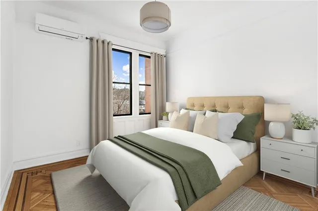 a bedroom with a bed and window