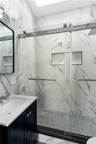 a bathroom with a sink and a mirror