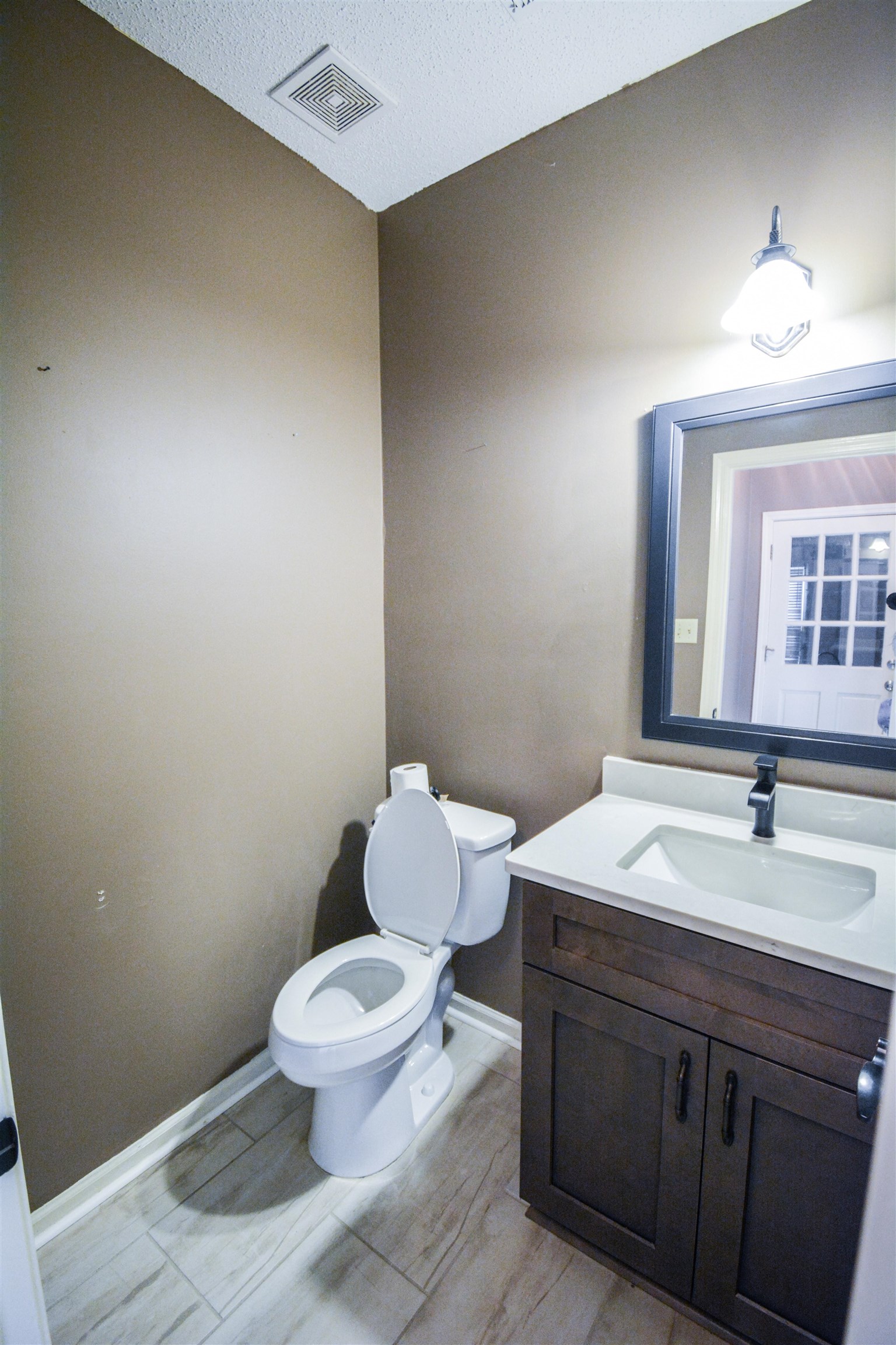 745 Roehampton Court Collierville, TN 38017 - Photo 11 of 40 a bathroom with a toilet a sink and mirror