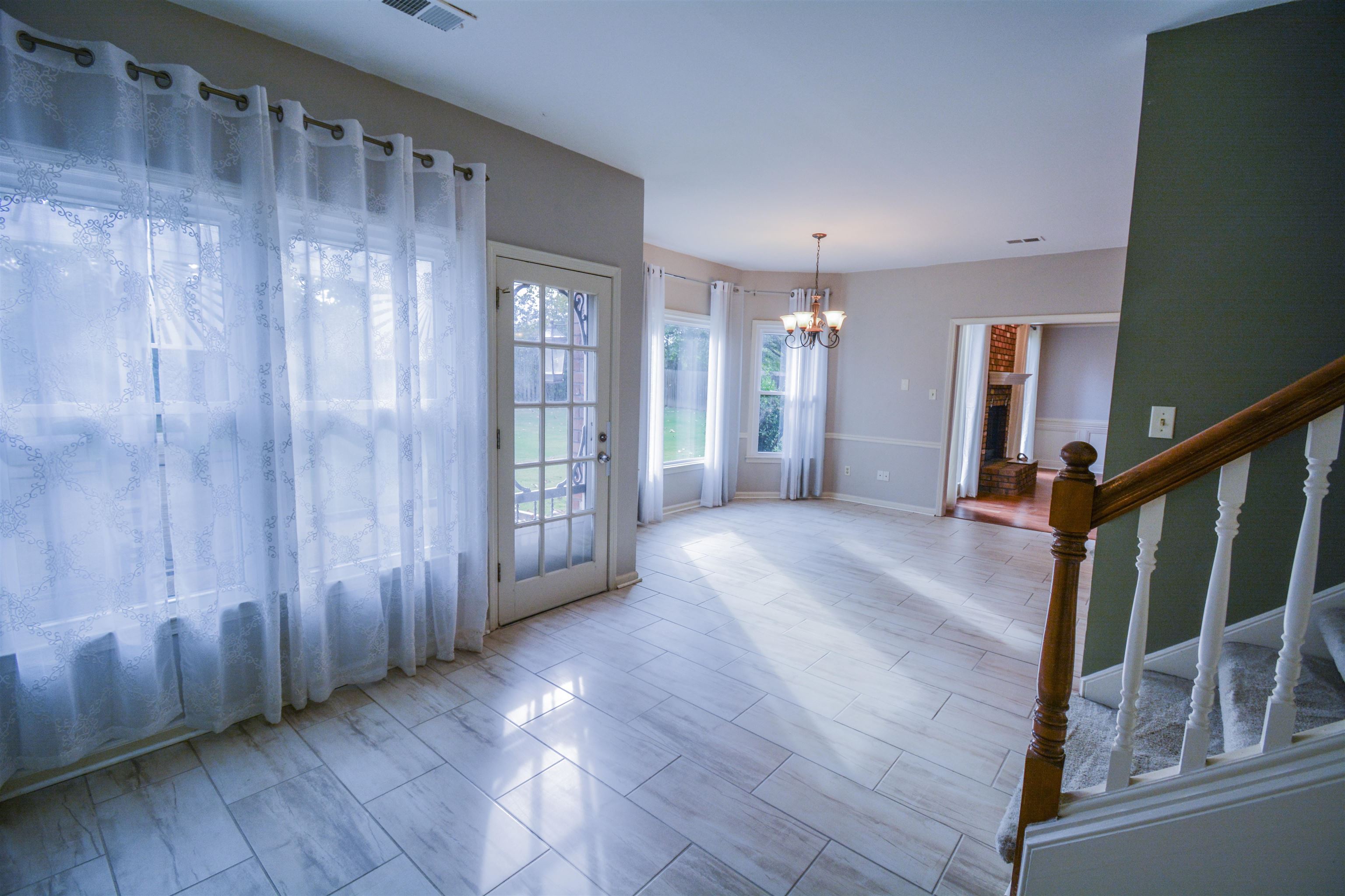 745 Roehampton Court Collierville, TN 38017 - Photo 14 of 40 Unfurnished room featuring a chandelier and stairs