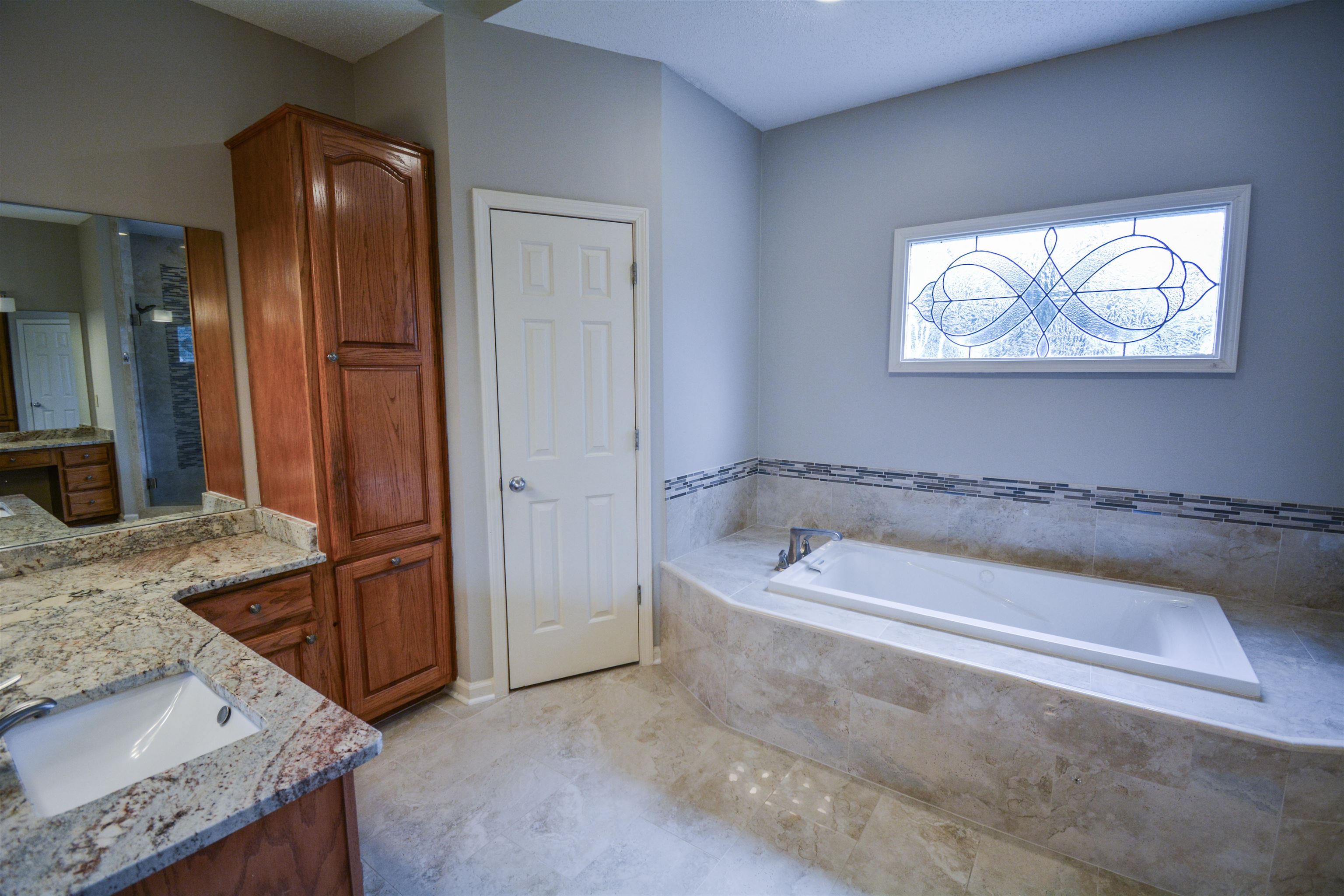 745 Roehampton Court Collierville, TN 38017 - Photo 20 of 40 Full bathroom with vanity and a bath