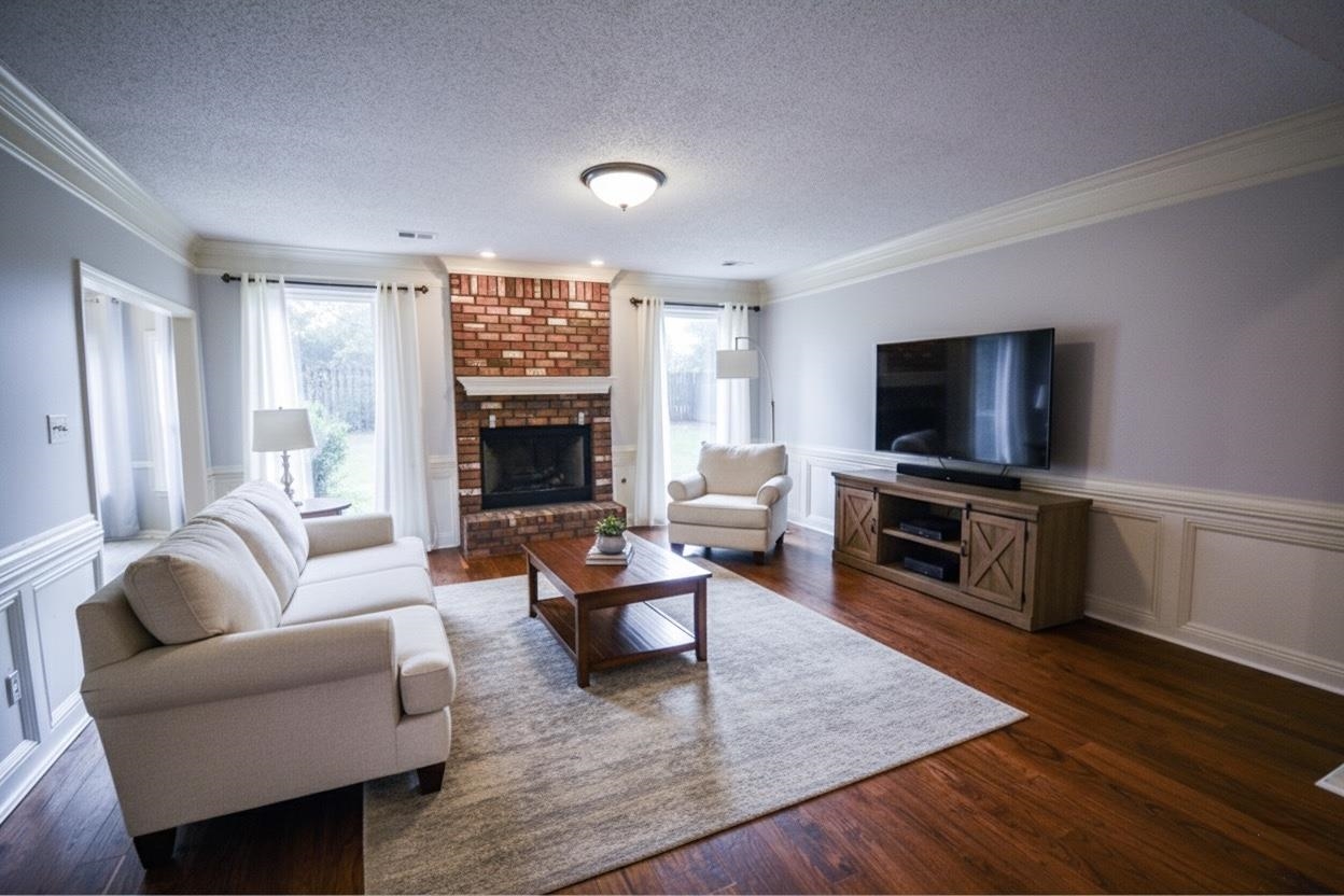745 Roehampton Court Collierville, TN 38017 - Photo 22 of 40 a living room with furniture and a flat screen tv
