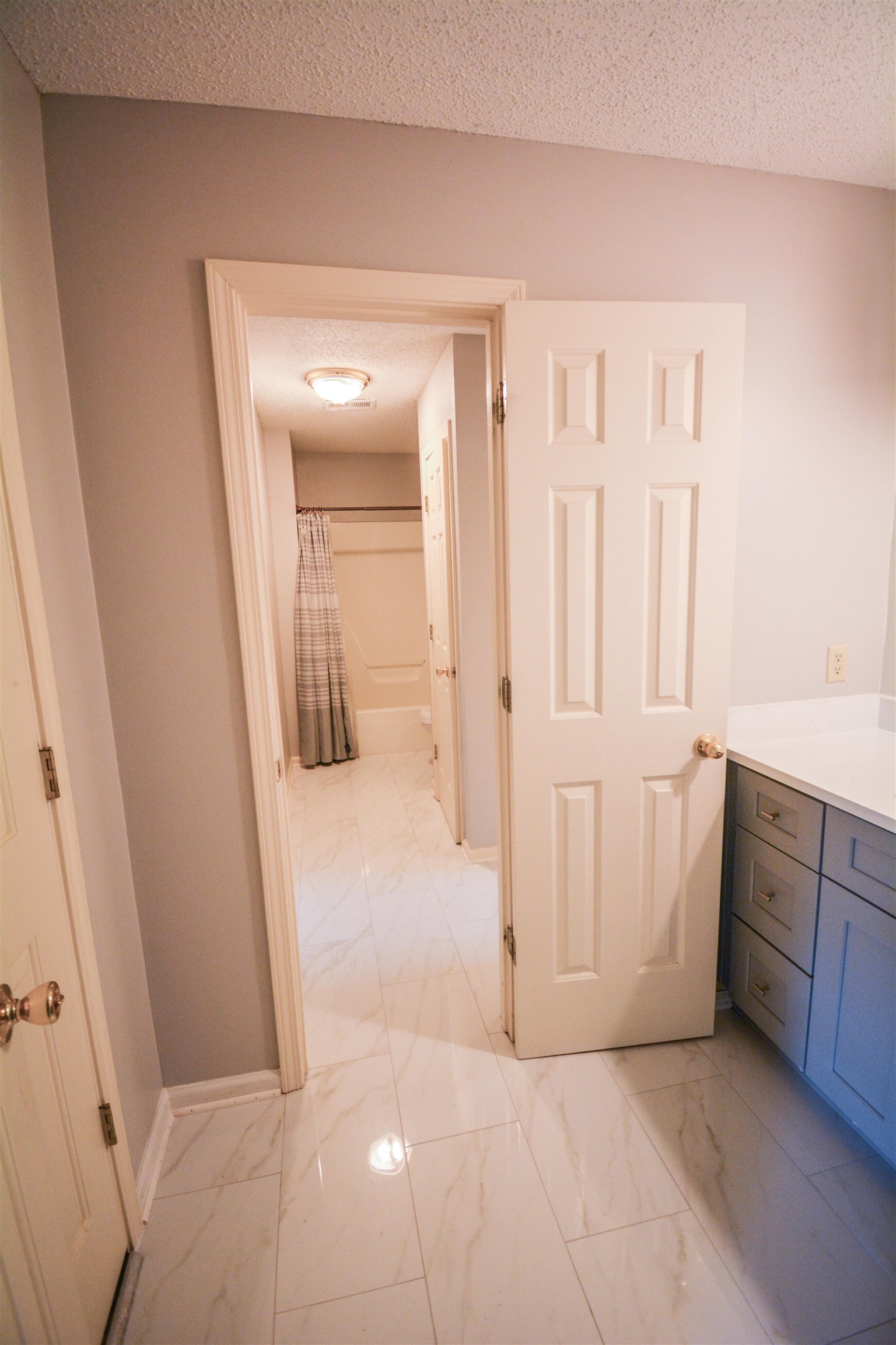 745 Roehampton Court Collierville, TN 38017 - Photo 27 of 40 Bathroom with light marble finish flooring, a textured ceiling, and vanity