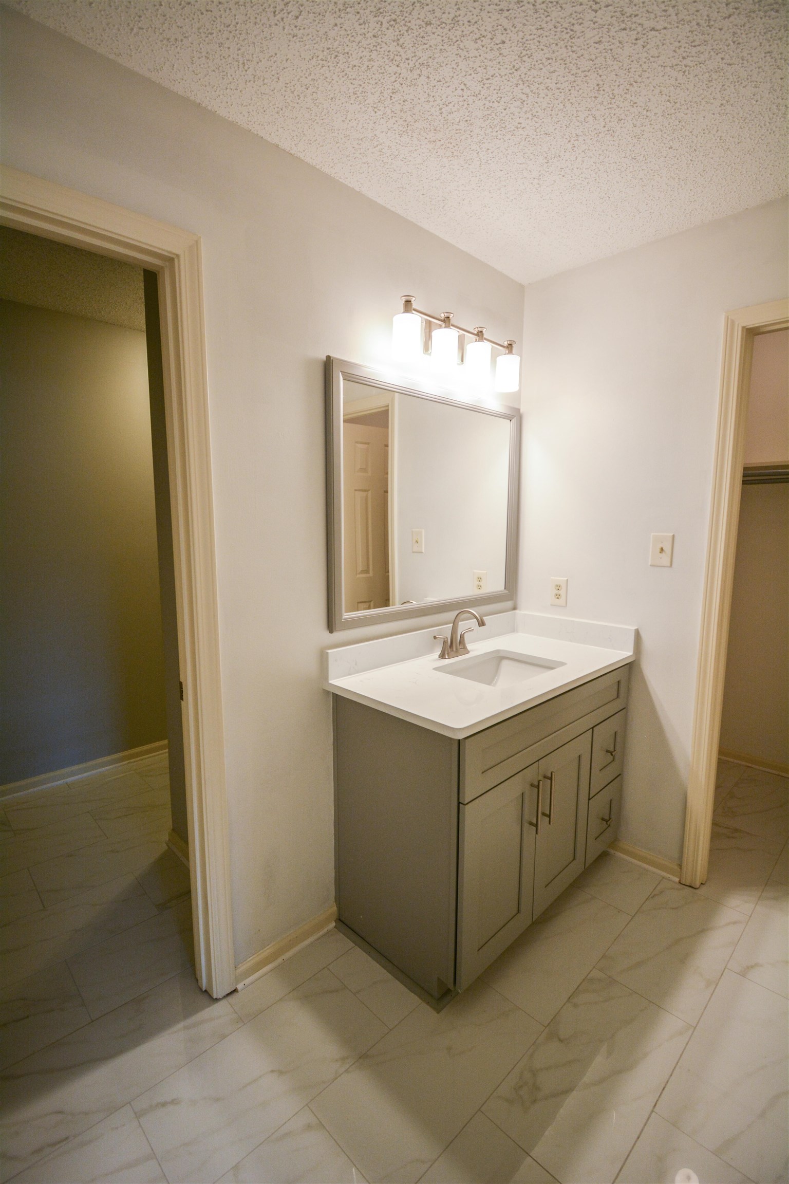 745 Roehampton Court Collierville, TN 38017 - Photo 28 of 40 a bathroom with a double vanity sink and mirror