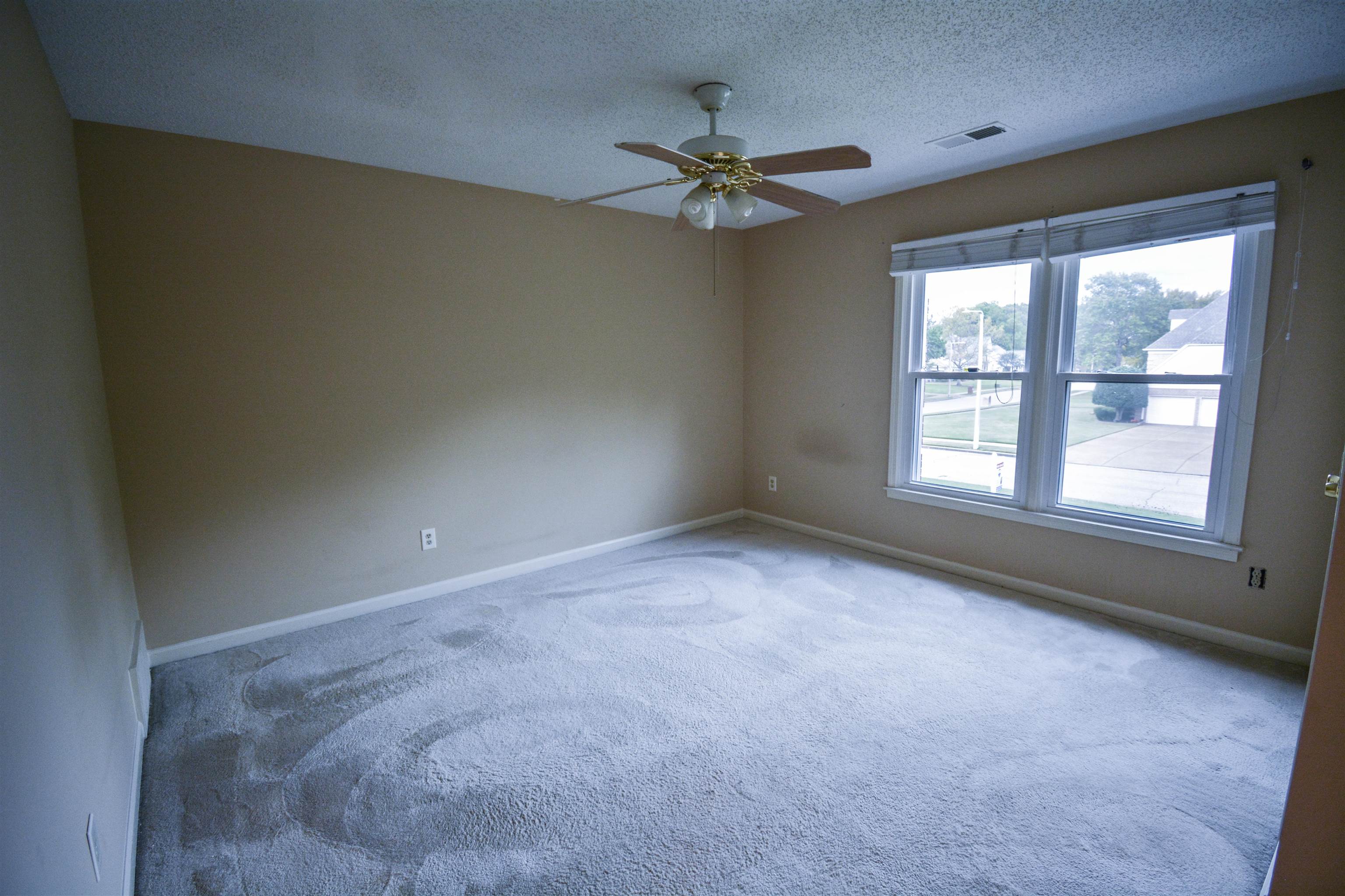 745 Roehampton Court Collierville, TN 38017 - Photo 31 of 40 Unfurnished room with carpet floors, a textured ceiling, and a ceiling fan