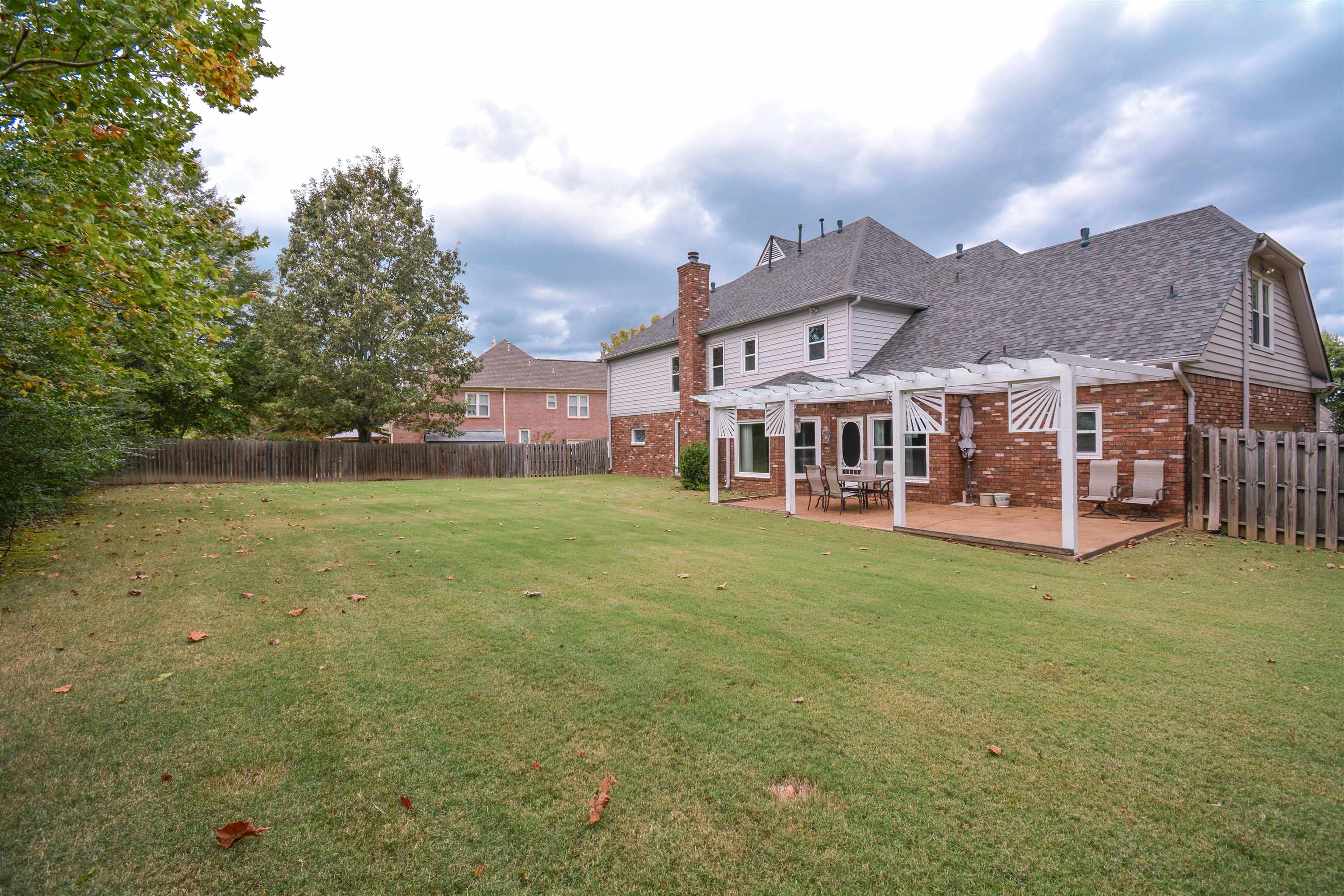 745 Roehampton Court Collierville, TN 38017 - Photo 37 of 40 a view of a house with a big yard and large trees