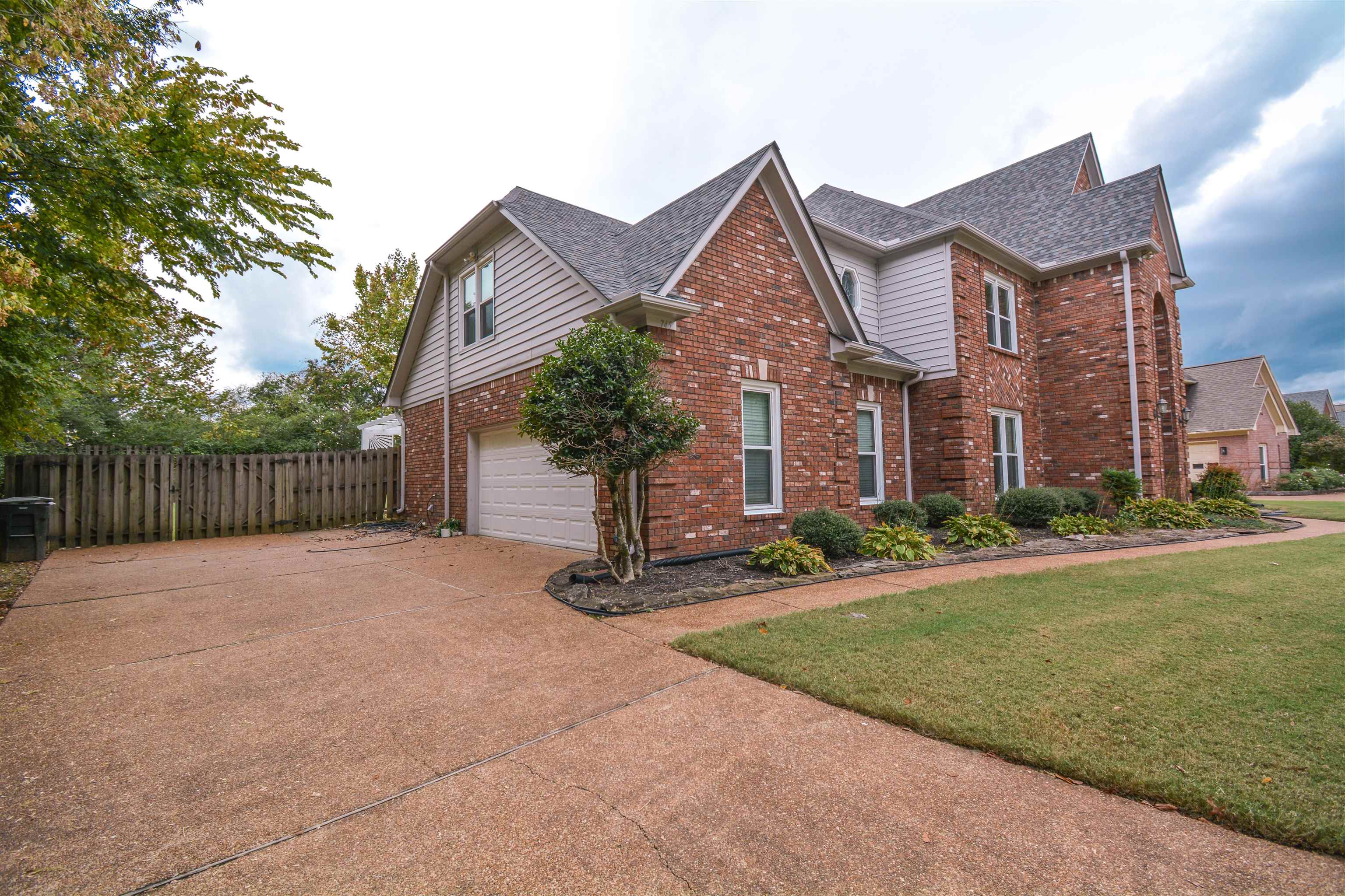 745 Roehampton Court Collierville, TN 38017 - Photo 39 of 40 a front view of a house with a yard and garage