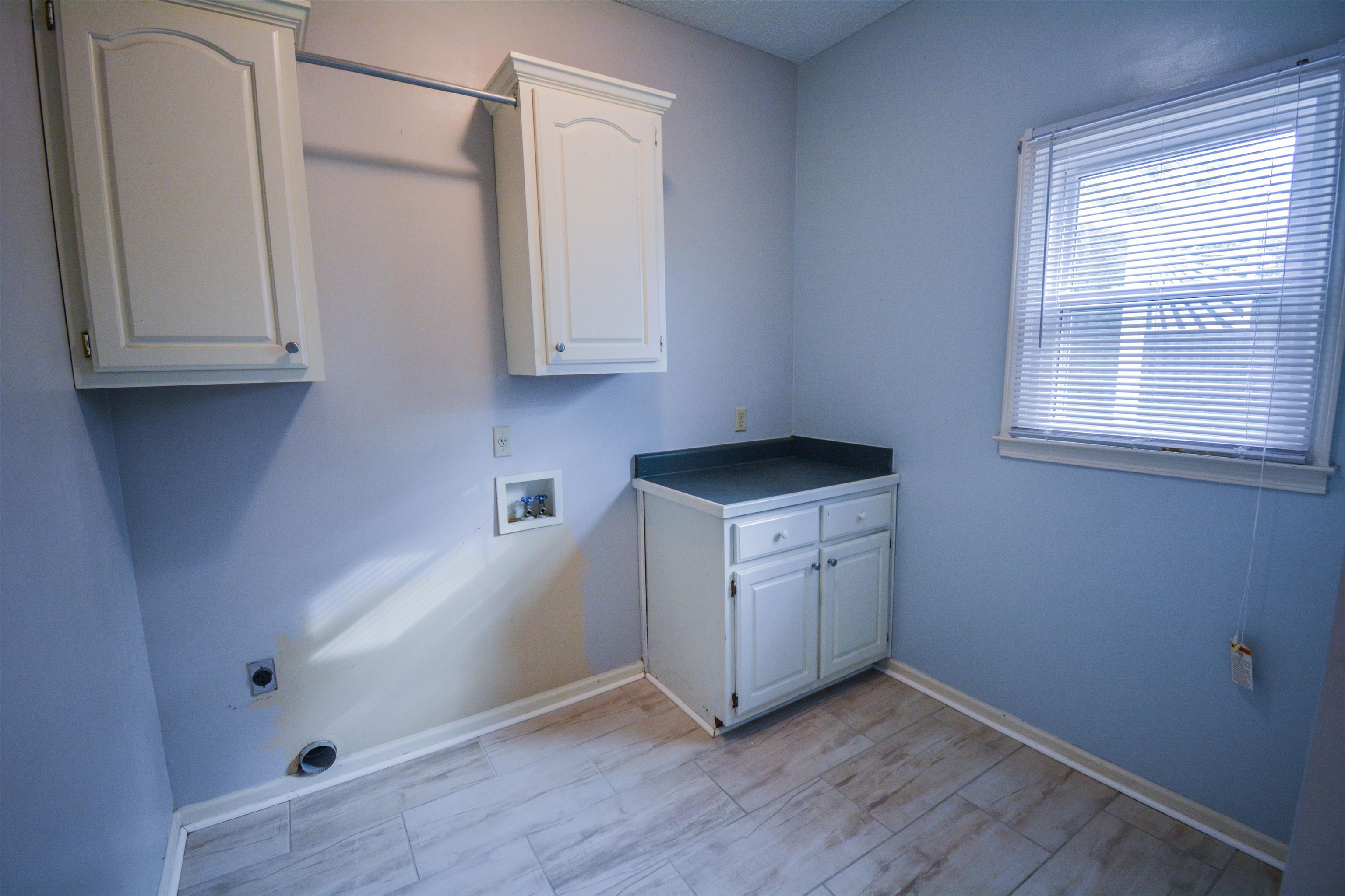745 Roehampton Court Collierville, TN 38017 - Photo 10 of 40 Washroom with cabinet space, hookup for a washing machine, and hookup for an electric dryer