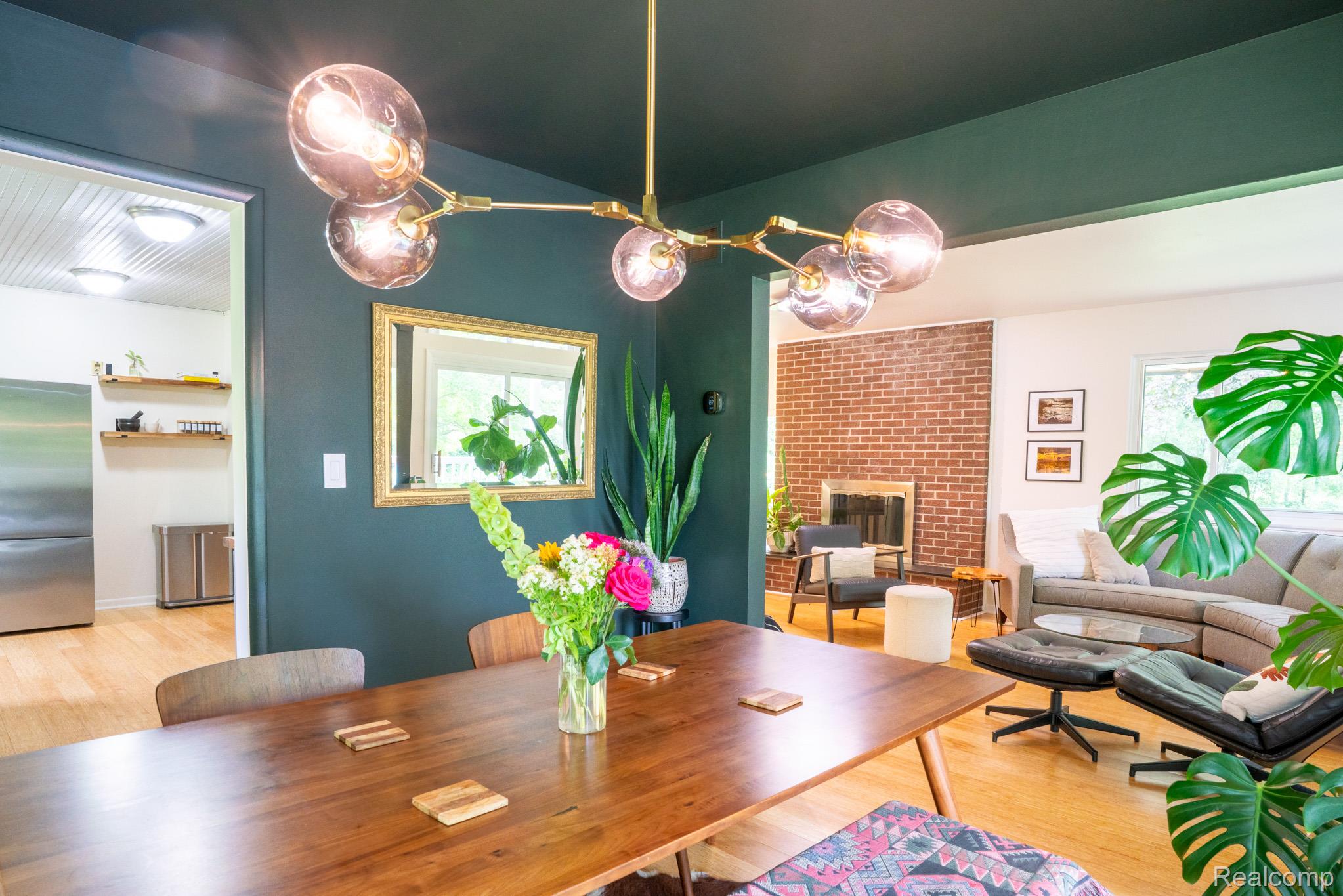 7333 Toma Road Dexter, MI 48130 - Photo 21 of 45 Open-concept dining and living areas featuring hardwood flooring