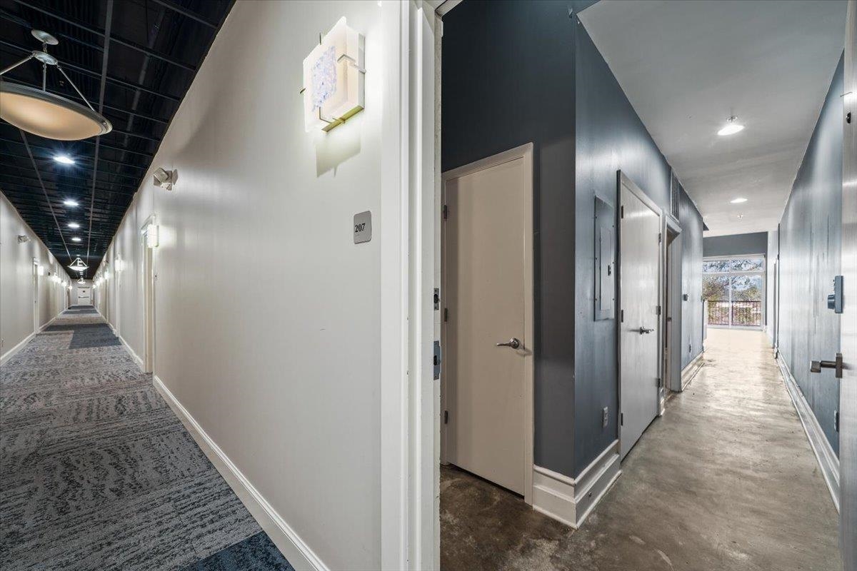 648 Riverside Drive, Unit 207 Memphis, TN 38103 - Photo 17 of 34 a view of a hallway with wooden floor