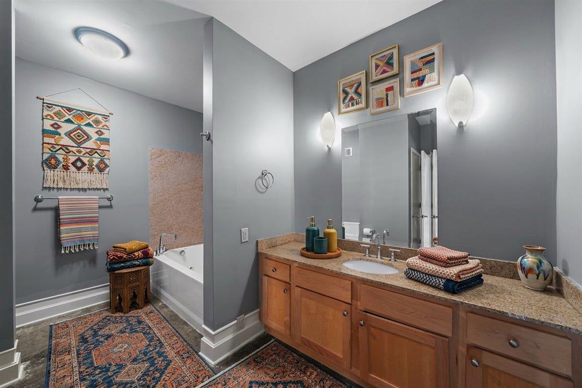 648 Riverside Drive, Unit 207 Memphis, TN 38103 - Photo 4 of 34 a bathroom with a sink and a mirror