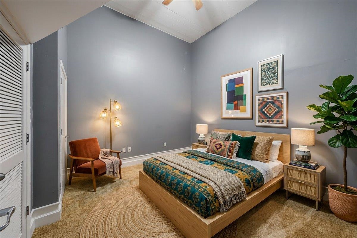 648 Riverside Drive, Unit 207 Memphis, TN 38103 - Photo 6 of 34 a bedroom with a bed and painting on the wall