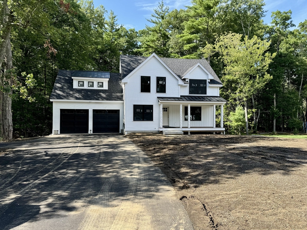 101 Folly Mill Road Salisbury, MA 01952 - Photo 1 of 32 a front view of a house with a garden