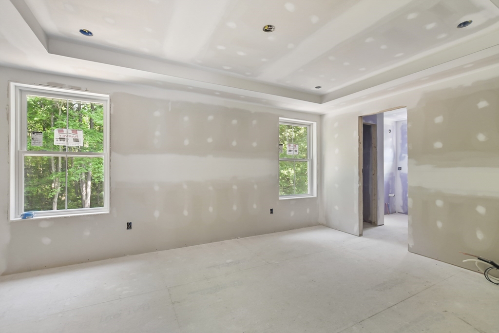101 Folly Mill Road Salisbury, MA 01952 - Photo 12 of 32 an empty room with windows and closet