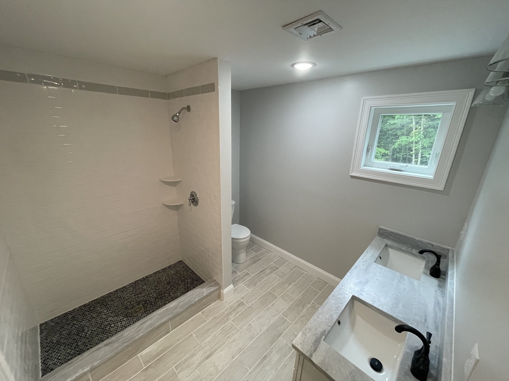101 Folly Mill Road Salisbury, MA 01952 - Photo 23 of 32 a bathroom with a sink and shower