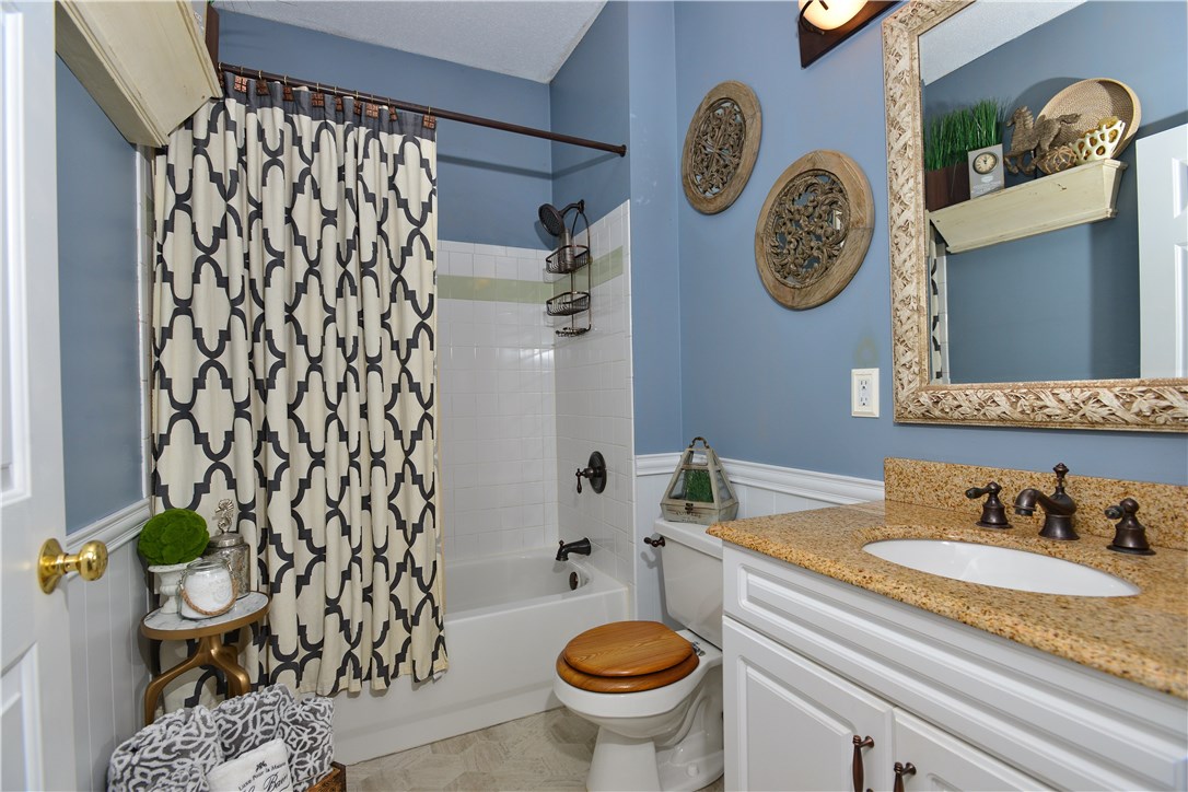 78 Mill Street, Unit 101 Woonsocket, RI 02895 - Photo 25 of 37 Granite, wainscoting, and new flooring.