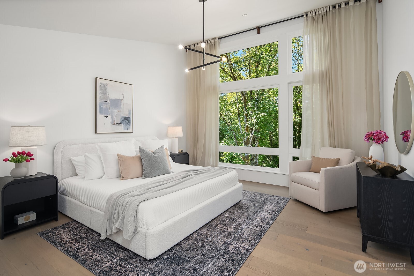 4255 216th Place Southeast Issaquah, WA 98029 - Photo 13 of 37 a bedroom with a bed a couch and a window