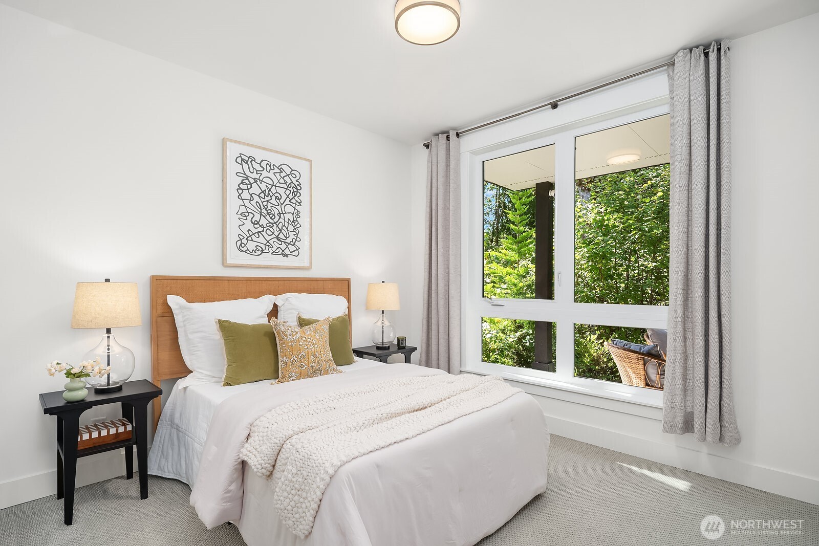 4255 216th Place Southeast Issaquah, WA 98029 - Photo 26 of 37 a bedroom with a large bed and a window