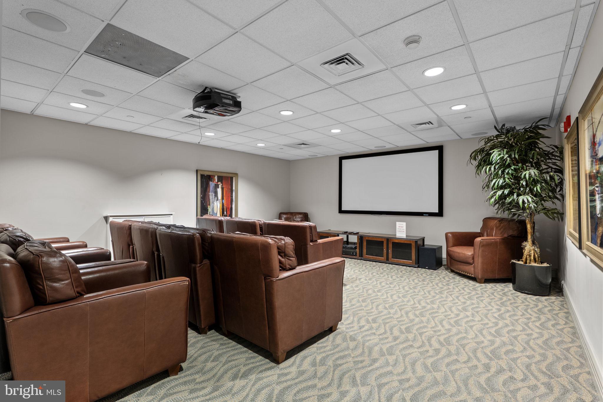 880 North Pollard Street, Unit 224 Arlington, VA 22203 - Photo 40 of 50 a living room with furniture and a flat screen tv