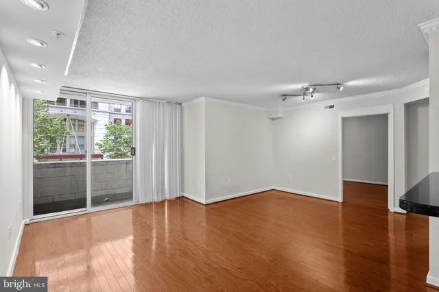 a view of a livingroom with wooden floor