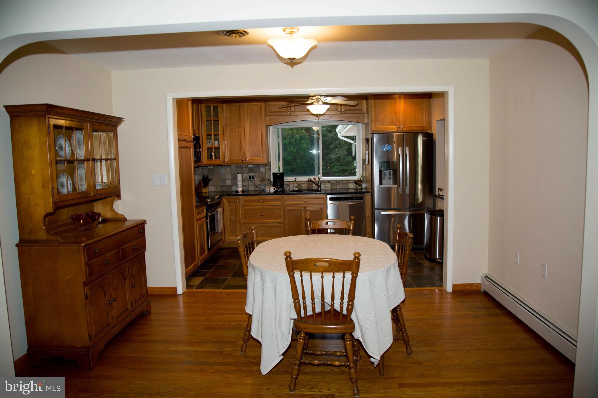 1722 Severn Road Severn, MD 21144 - Photo 7 of 45 a view of a dining room with furniture window and wooden floor
