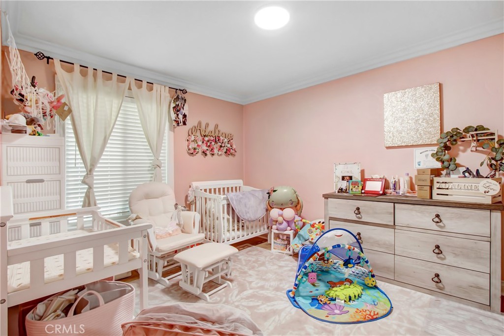 8555 Pigeon Pass Road Moreno Valley, CA 92557 - Photo 17 of 63 a living room with furniture and a wooden floor