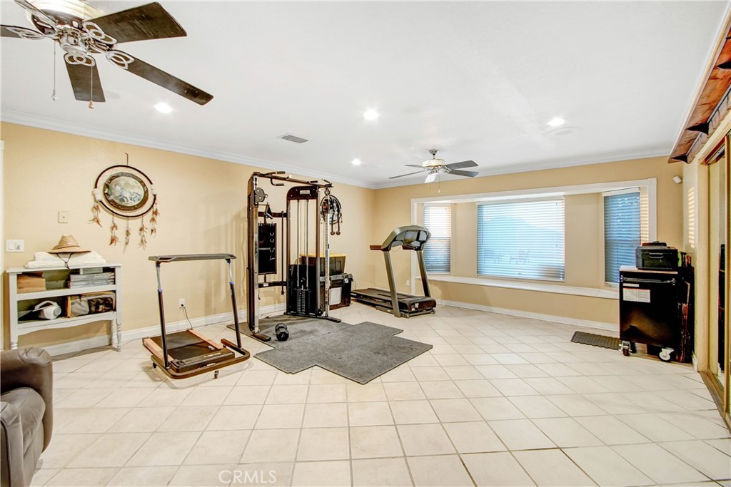8555 Pigeon Pass Road Moreno Valley, CA 92557 - Photo 23 of 63 a view of a room with gym equipment