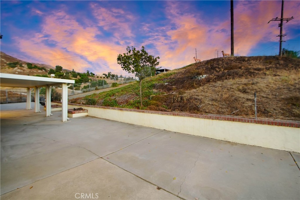 8555 Pigeon Pass Road Moreno Valley, CA 92557 - Photo 29 of 63 a view of a road with a building in the background