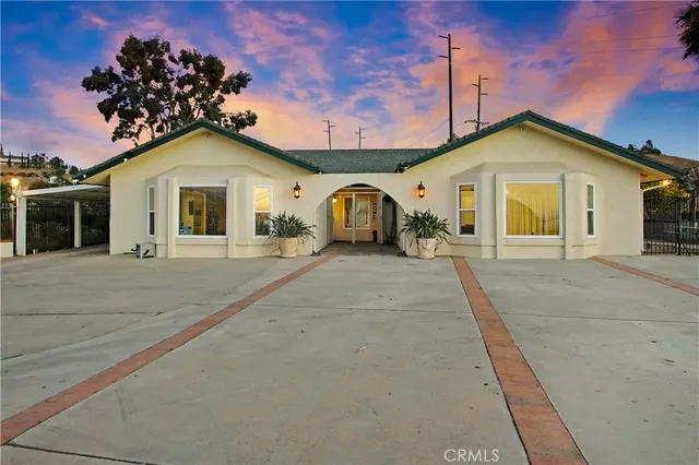 a view of swimming pool with a table and chairs