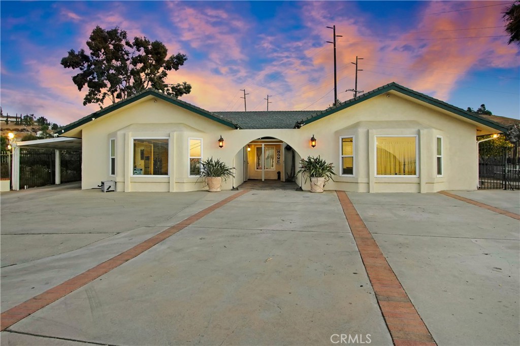 8555 Pigeon Pass Road Moreno Valley, CA 92557 - Photo 32 of 63 a view of a house with a patio