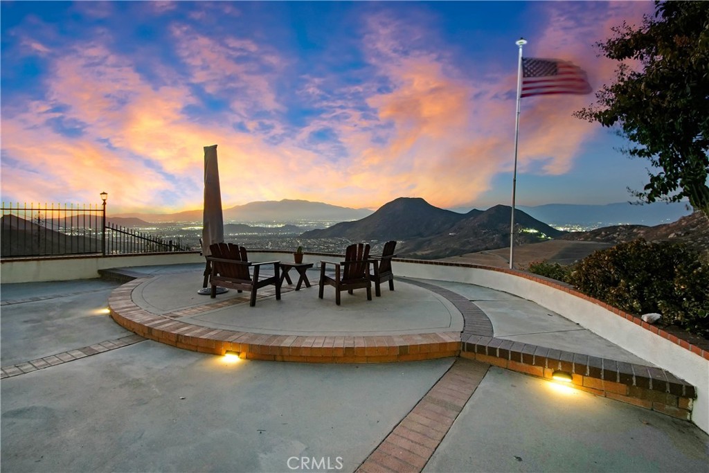 8555 Pigeon Pass Road Moreno Valley, CA 92557 - Photo 36 of 63 a view of swimming pool with a table and chairs