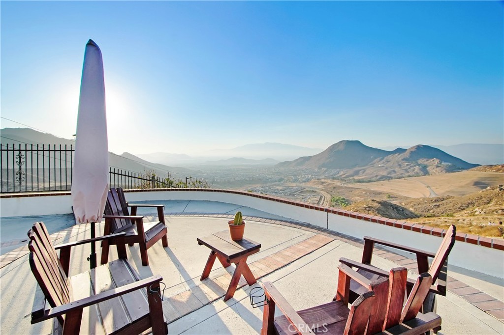 8555 Pigeon Pass Road Moreno Valley, CA 92557 - Photo 37 of 63 a view of a chairs and table on the terrace