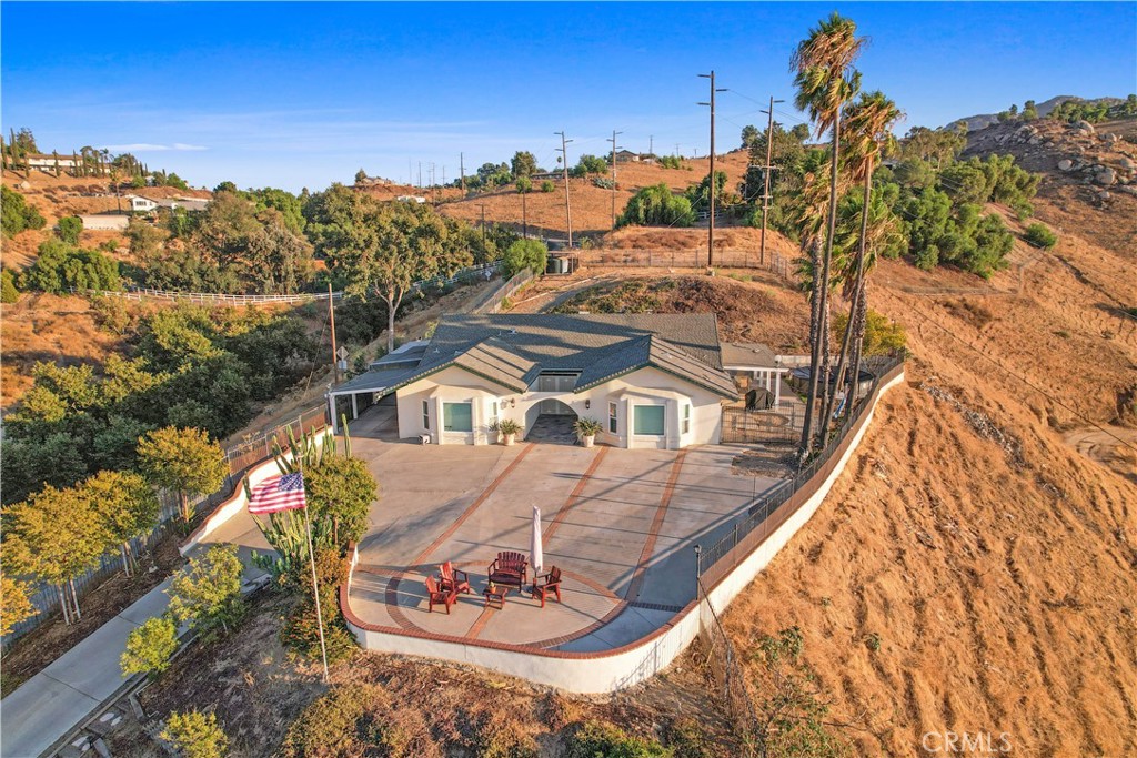 8555 Pigeon Pass Road Moreno Valley, CA 92557 - Photo 42 of 63 a view of a house with a yard