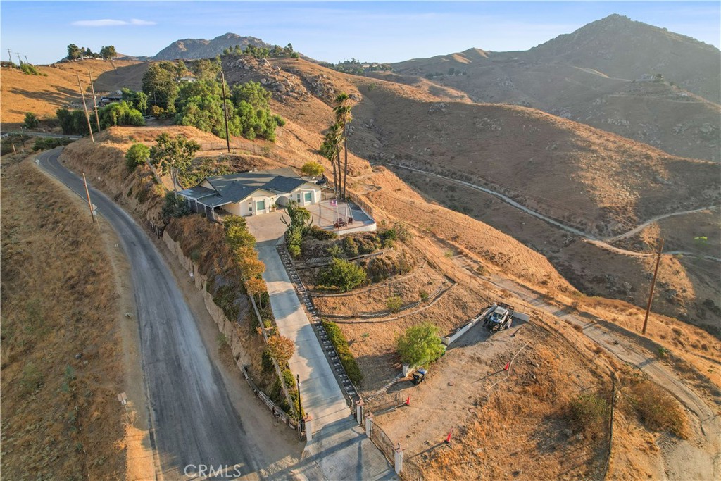 8555 Pigeon Pass Road Moreno Valley, CA 92557 - Photo 44 of 63 a view of a house with a mountain