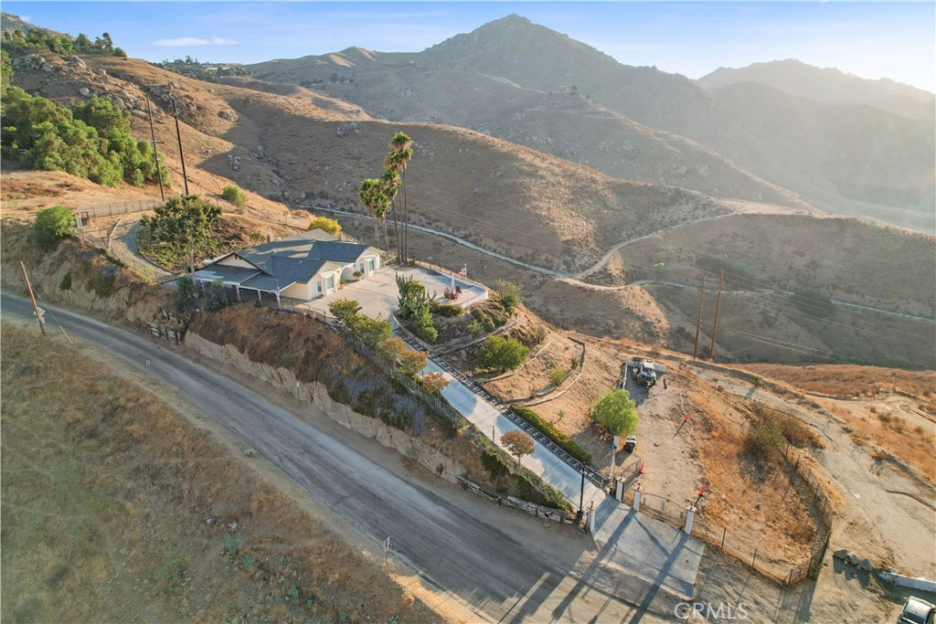 8555 Pigeon Pass Road Moreno Valley, CA 92557 - Photo 45 of 63 a view of a house with a mountain