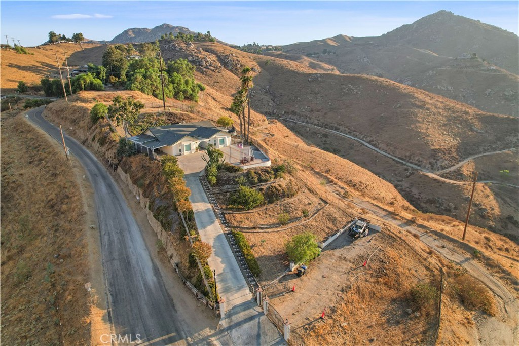 8555 Pigeon Pass Road Moreno Valley, CA 92557 - Photo 62 of 63 a view of a house with a mountain