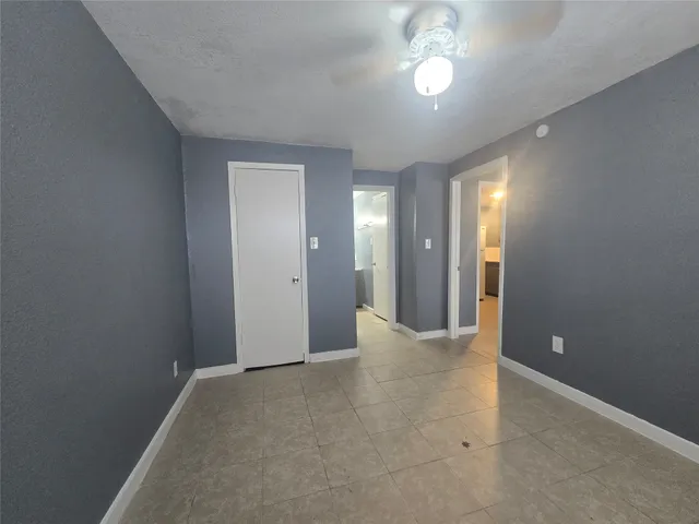 an empty room with closet area