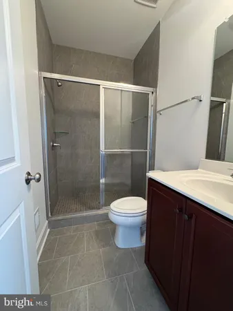 a bathroom with a shower and a toilet