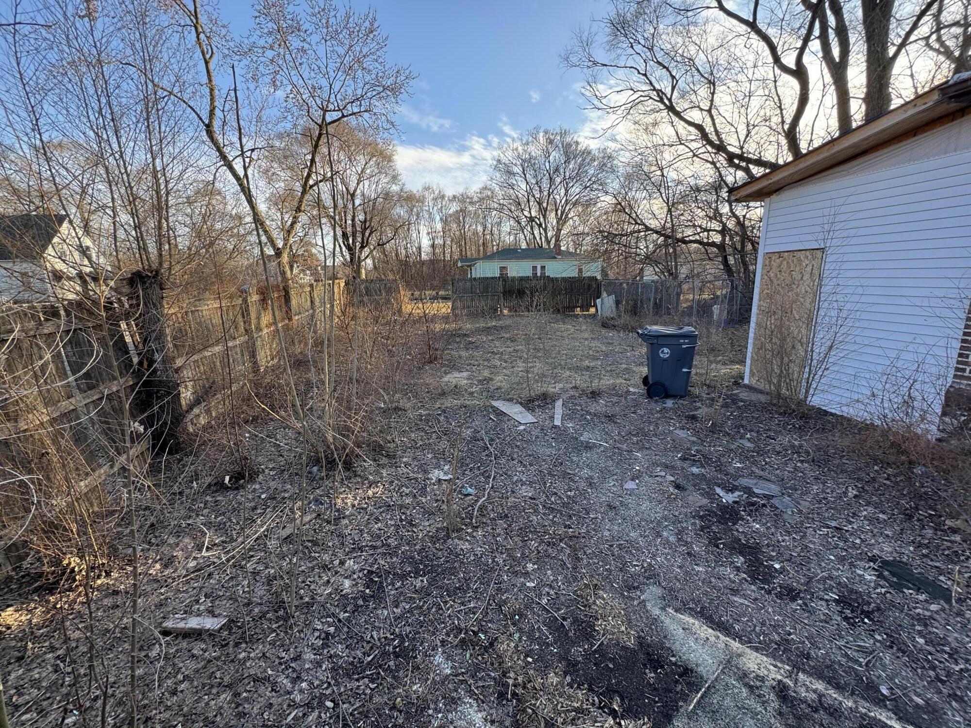 1105 West 15th Avenue Gary, IN 46407 - Photo 7 of 14 a view of a yard covered with trees