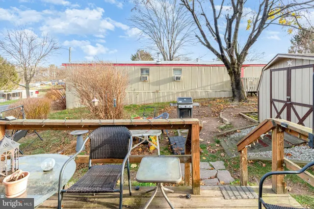 a view of a patio with iron fence